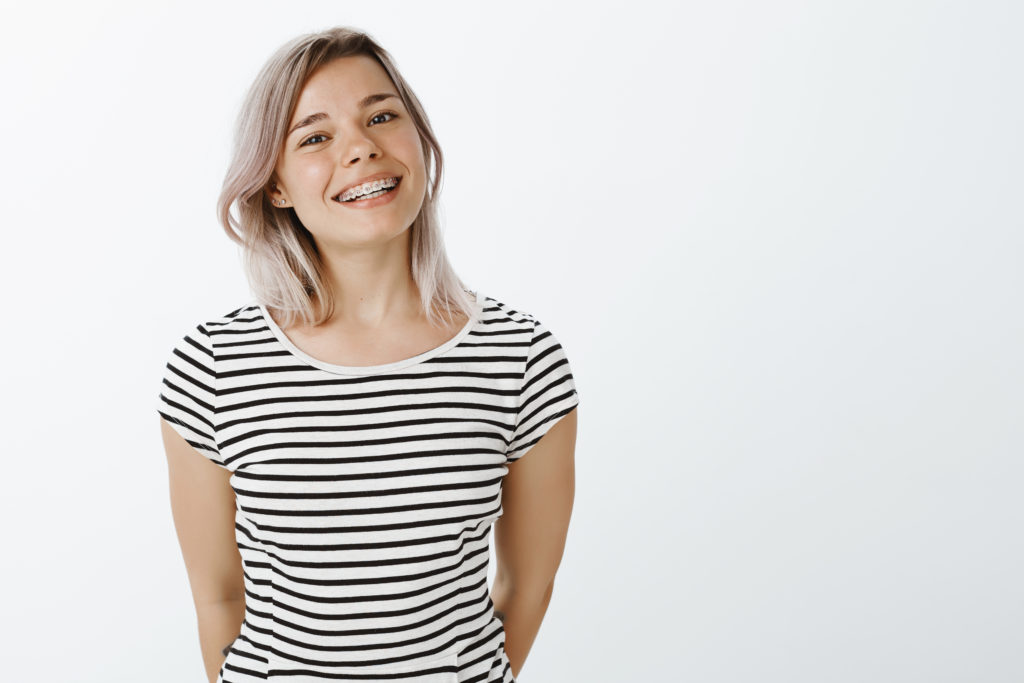 Smiling patient after completing orthodontic treatment at Bankhead Orthodontic Specialists