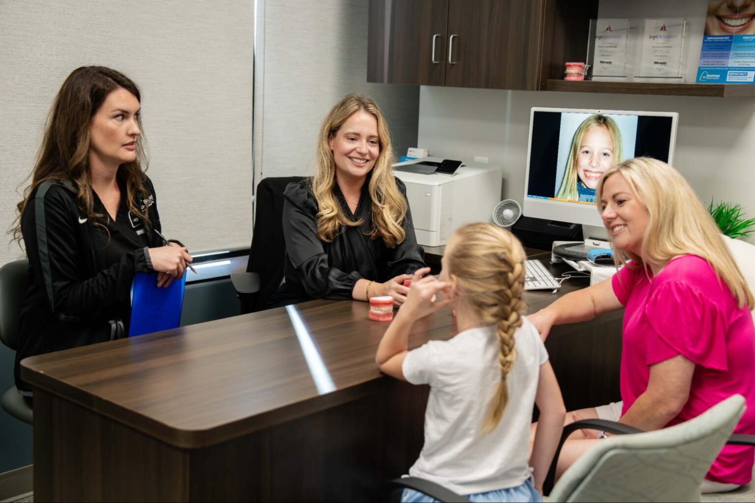 Orthodontist in Lake St. Louis examining a patient at Bankhead Orthodontic Specialists